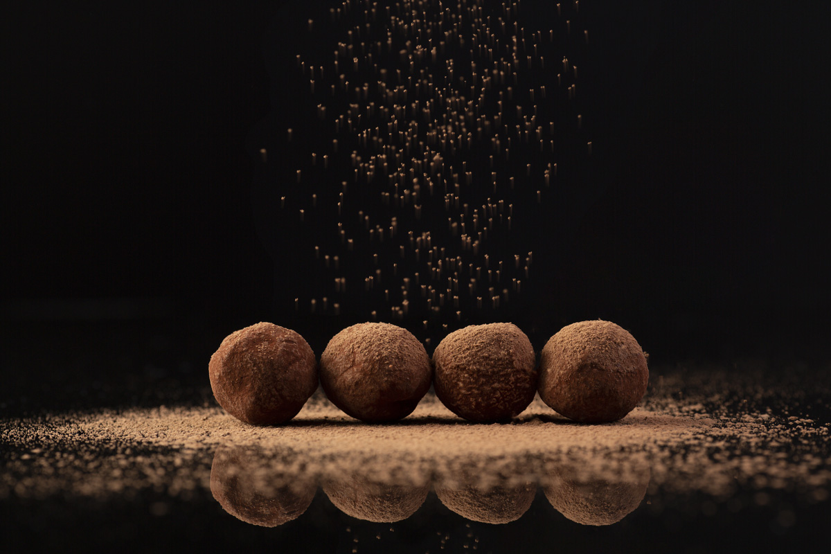 Chocolate truffles properly decorated with cocoa powder
